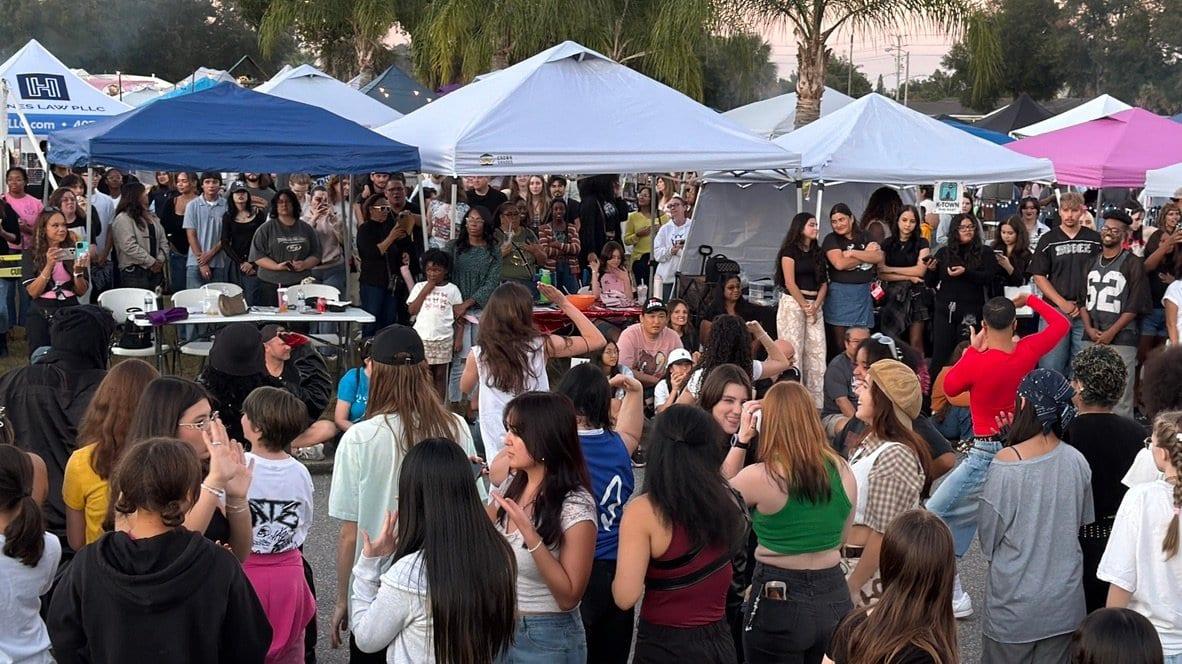 The front rows of the crowd waiting for the next dance