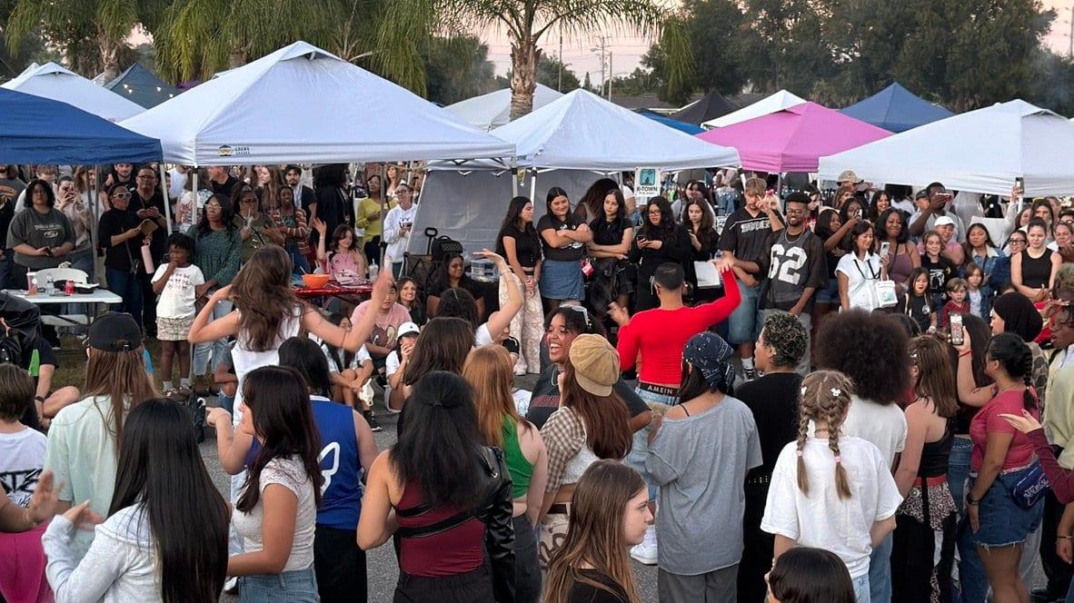 Festival-goers gathered under the tents as the sun goes down